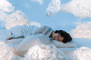 person sleeping on clouds
